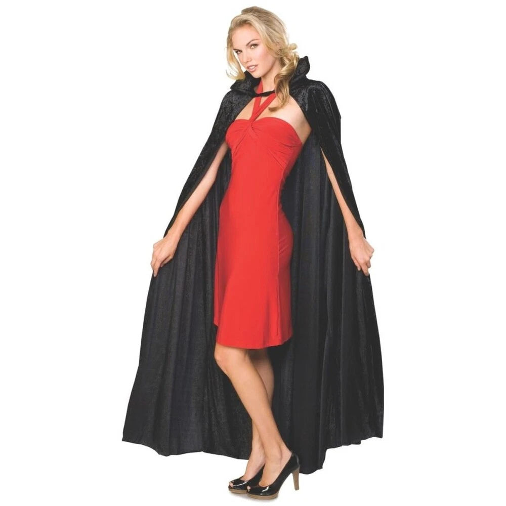 Woman wearing a red dress with a black cape on a white background
